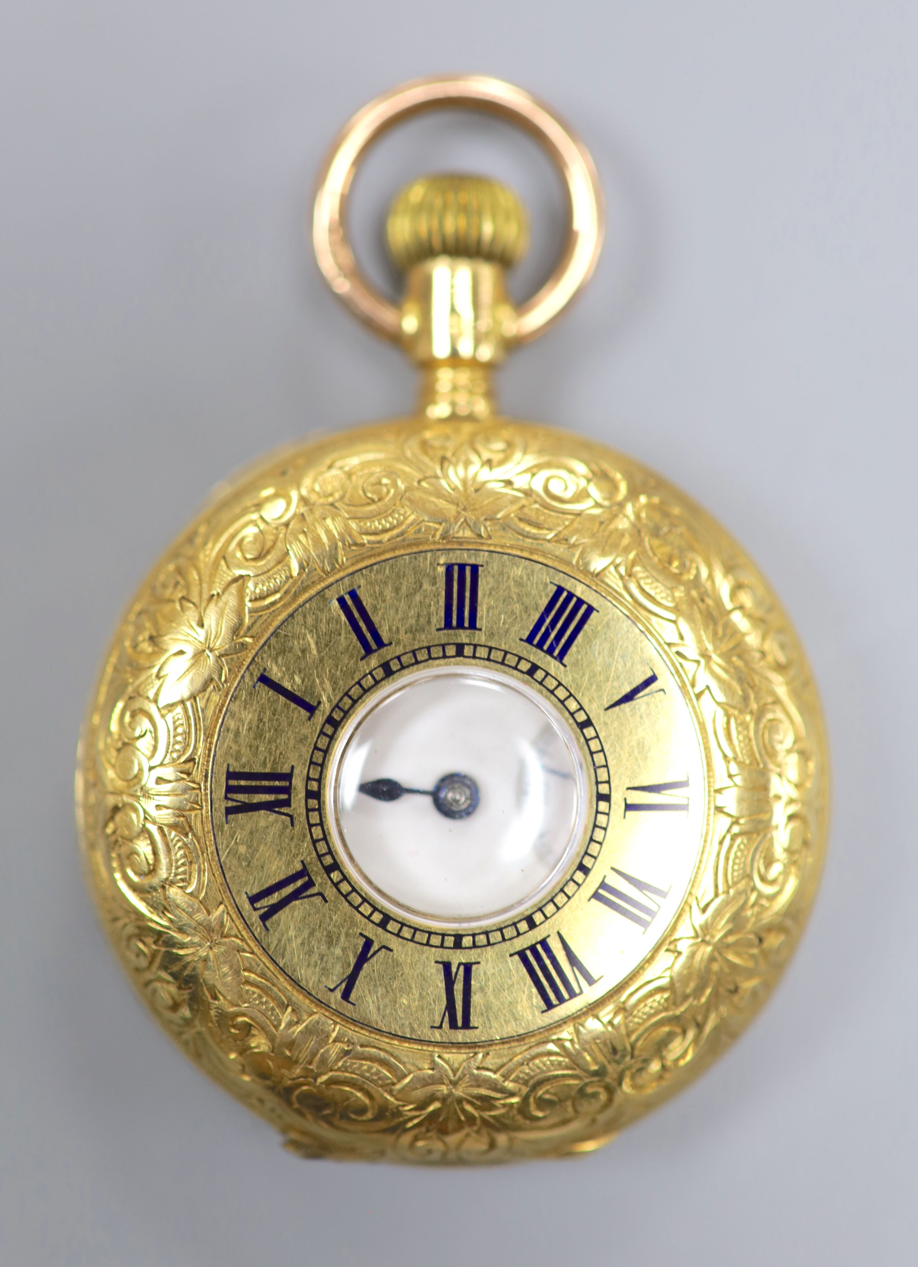 An American Waltham engraved 18ct yellow metal half hunter fob watch, case diameter 32mm, gross 44.5 grams.